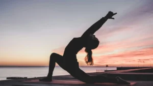 Woman Performing Hatha Yoga In Rishikesh | Sage House Yoga