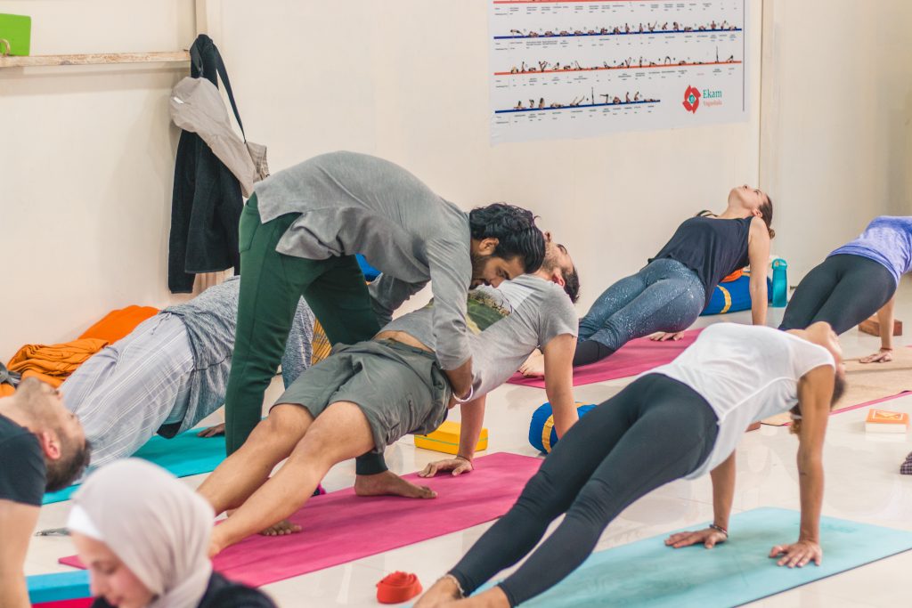 a group of people doing yoga at sage house yoga