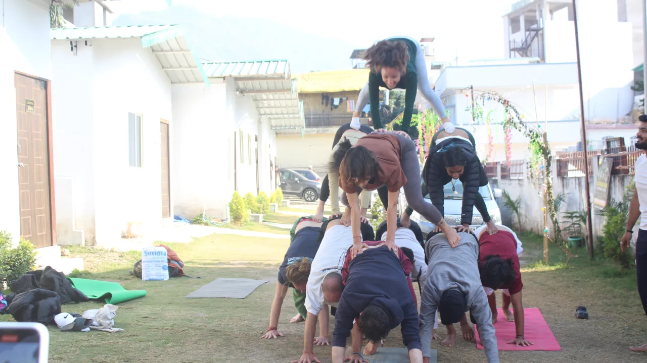 Yoga Students Practicing Partner Yoga in Rishikesh India | Sage House Yoga