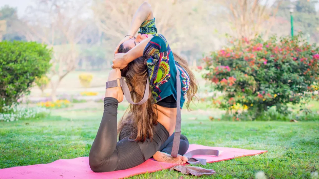 Yoga student in yoga pose during training in Rishikesh garden